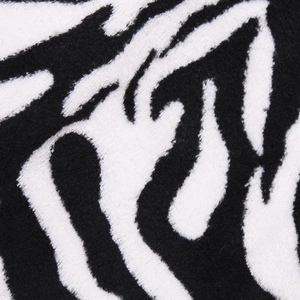 Gros plan sur le tissu en flanelle doux à motif zèbre noir et blanc pour animaux