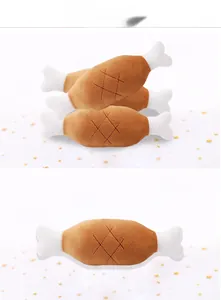 Macro shot of plush drumstick dog toy with soft brown fabric and reinforced cross stitching