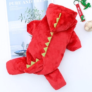 Detail of red dinosaur dog costume in plush fleece with green scales and soft texture