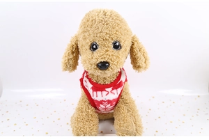 Close-up of soft red flannel pet vest with festive white reindeer and snowflake patterns