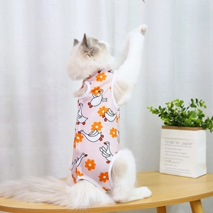 Close-up of pink pet recovery suit with cartoon goose patterns on a long-haired cat