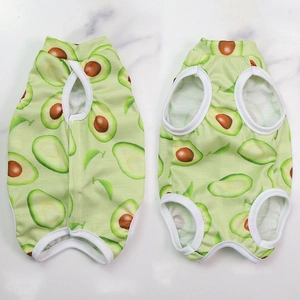 Detail of pet recovery suit with avocado print showing breathable fabric and white piping