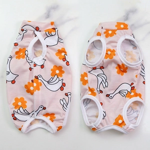 Detailed flat lay of pink pet recovery suit with cartoon goose and floral print