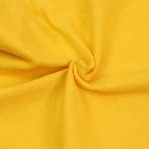 Macro view of bright yellow breathable cotton knit fabric for pet t-shirt and dog vest