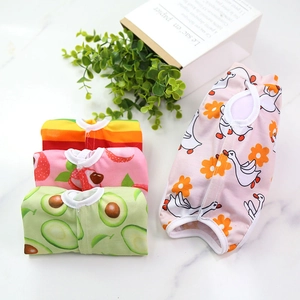 Detail view of cotton pet recovery suits in pink goose and avocado prints for dogs and cats
