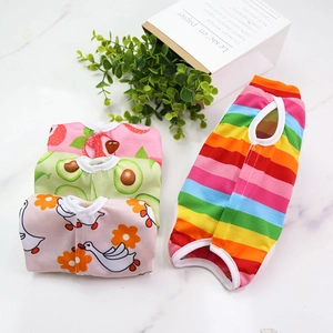 Flat lay of breathable pet recovery vests in four cute strawberry and rainbow patterns