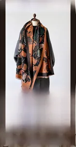 Detailed texture of imitation cashmere winter scarf with cat patterns and short tassels