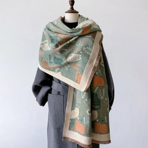 Detail of sage green cat patterned cashmere pashmina shawl with fringe tassels