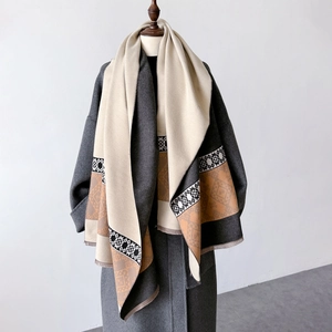 Detail of ethnic geometric print and thick fabric texture on oversized shawl scarf