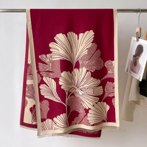 Thick burgundy winter scarf for women featuring elegant beige ginkgo leaf pattern and fringe