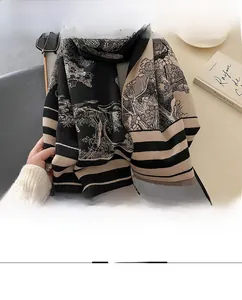 Detail of warm winter shawl with Chinese landscape print and soft tassel edges