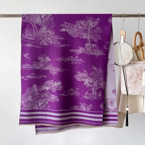 Detail of purple Toile de Jouy scarf featuring forest patterns and delicate fringed edges