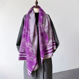 Detailed view of purple floral landscape pattern on large shawl with elegant fringe