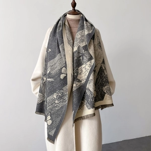 Dual-sided cashmere-like scarf with butterfly print and fringe, styled on a wool coat