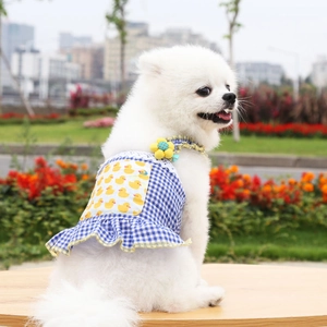 Close-up of lightweight blue plaid pet dress with yellow duck patch for small dogs