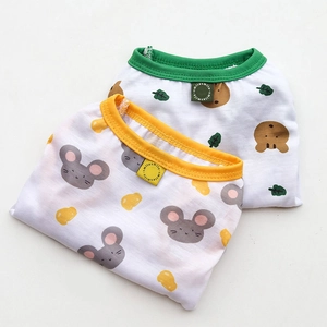 Close-up of soft cotton pet vests featuring cartoon bear and mouse patterns for dogs