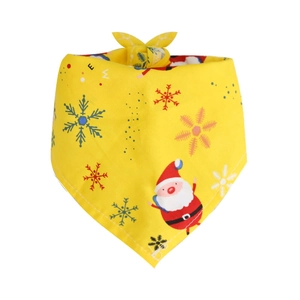 Detailed view of yellow Christmas pet bandana with Santa Claus and snowflake patterns