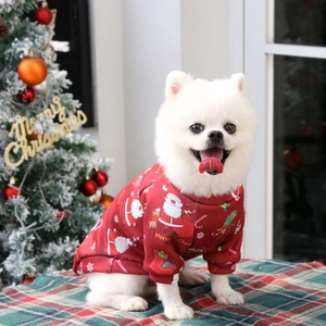 Christmas themed fleece dog hoodie with festive Santa prints on a soft red sweater fabric