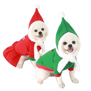 Matching Christmas pet outfits featuring red dress and green hoodie with white faux fur trim
