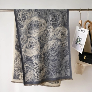 Detail of floral jacquard shawl showing double-sided rose pattern and fringe edges