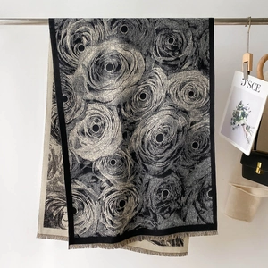 Close-up of floral print shawl showing refined tassel edges and realistic rose patterns