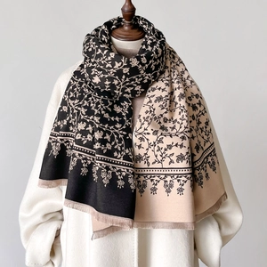 Thick cashmere-like winter scarf with beige floral print and elegant tassel fringe