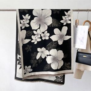 Elegant black and white floral print pashmina shawl with fringe for winter warmth