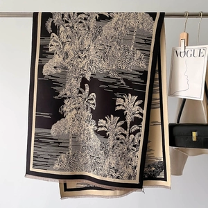 Detail of vintage tropical palm tree print scarf with fine fringe on a hanging display