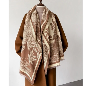 Detail of retro palm tree pattern and fringe on thick brown shawl wrap for women