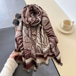 Luxurious thick cashmere-feel scarf with geometric leaf patterns and tassel edges