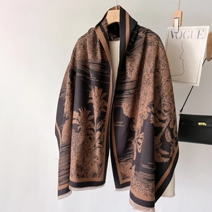 Retro palm tree pattern scarf in dark brown and black hanging on a wooden hanger