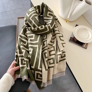 Olive green and beige geometric scarf with fringe details and soft knit texture