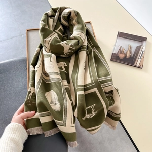 Detail shot of vintage green plaid scarf with horse pattern and fine tassel edges