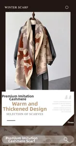 Detailed view of warm faux cashmere winter scarf with cute cat patterns and color blocks