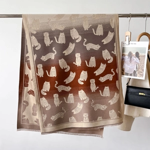 Thick gradient knitted scarf featuring cartoon cat patterns and decorative fringe trim