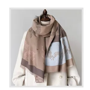 Detailed texture of thick zebra pattern shawl with fine fringe in earth tones and light blue