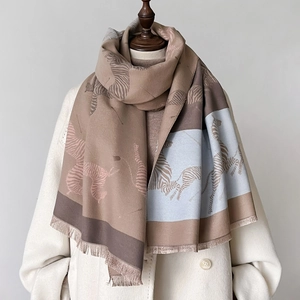 Thick zebra print scarf with khaki blue color blocking and fringe on white coat