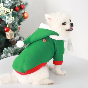 Detail of green Christmas dog hoodie with red trim and 3D reindeer on soft fleece fabric