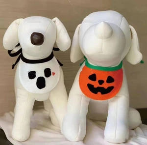 Close-up of Halloween pet bibs featuring ghost and pumpkin designs for small dogs and cats