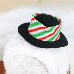 Close-up of a mini Christmas pet hat with festive red and green striped plush ribbon detail