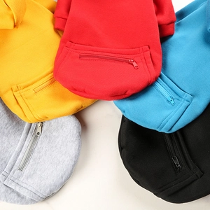 Close-up of pet hoodies in five colors featuring functional zipper pockets and cotton texture