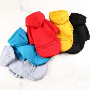 Flat lay of five colorful hooded pet hoodies with zipper pockets for dogs and cats