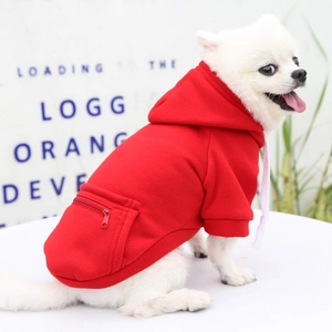 Detail of red pet hoodie featuring a functional zipper pocket and drawstring hood
