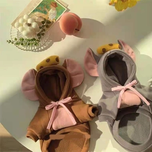 Detail of pet hoodies with 3D ears, pink bows, and cheese decor in fleece fabric