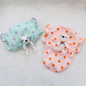 Detail of soft cotton pet clothes with colorful polka dots and cute teddy bear pocket toy