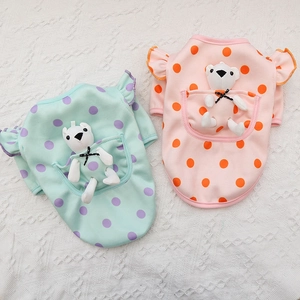 Detail of knit pet sweater featuring a cute plush bear in the back pocket and polka dots