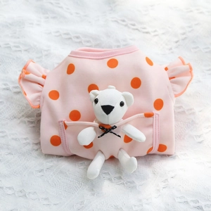 Close-up of pink polka dot pet sweater featuring a cute white teddy bear in the pocket