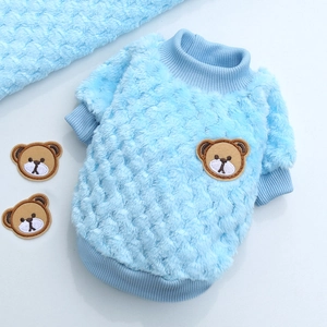 Detail of baby blue plaid fleece pet sweater featuring a cute brown bear embroidery