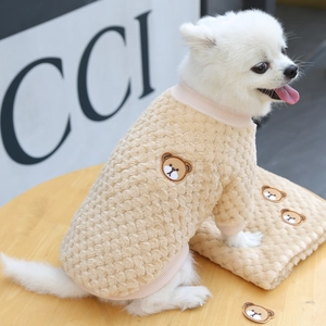 Close-up of warm beige sherpa fleece dog sweater featuring a cute teddy bear embroidery