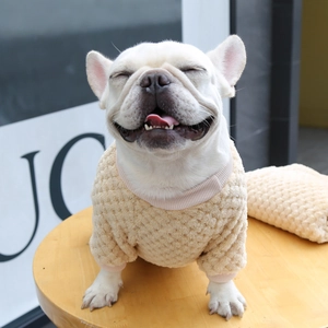 Detail of beige plaid fleece pet sweater with textured diamond pattern for small dogs